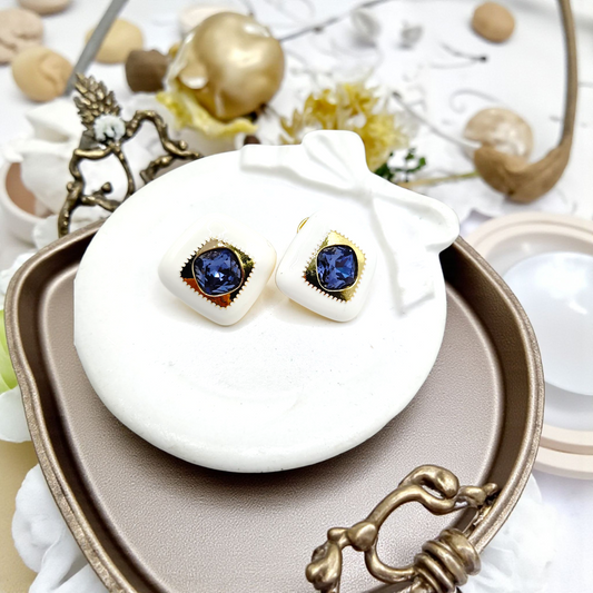 Elegant White Enamel Studs with Blue Gemstone