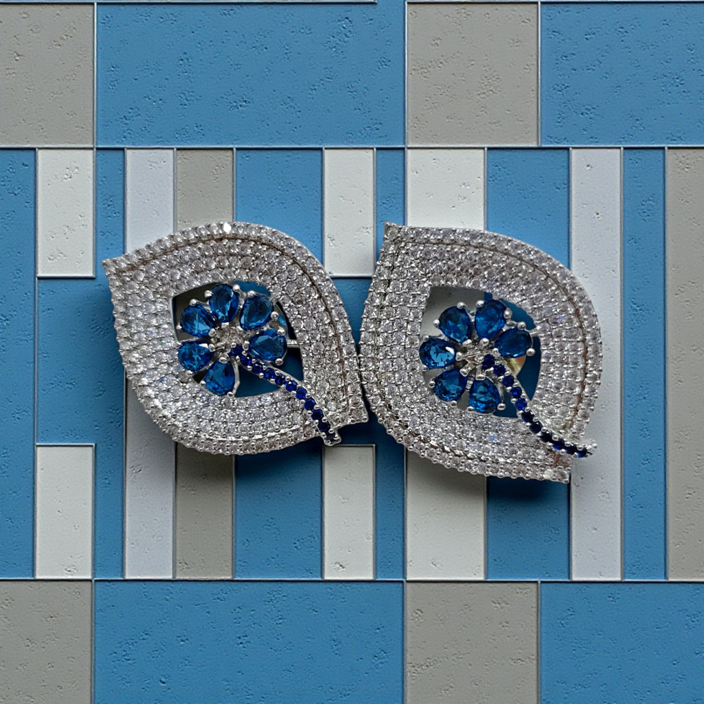 Silver Crystal Leaf Stud Earrings with Sapphire Blue Floral Center